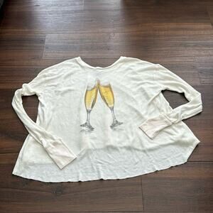 WildFox Pee Loved Long Sleeve Oversized Top with Champagne glasses graphic.